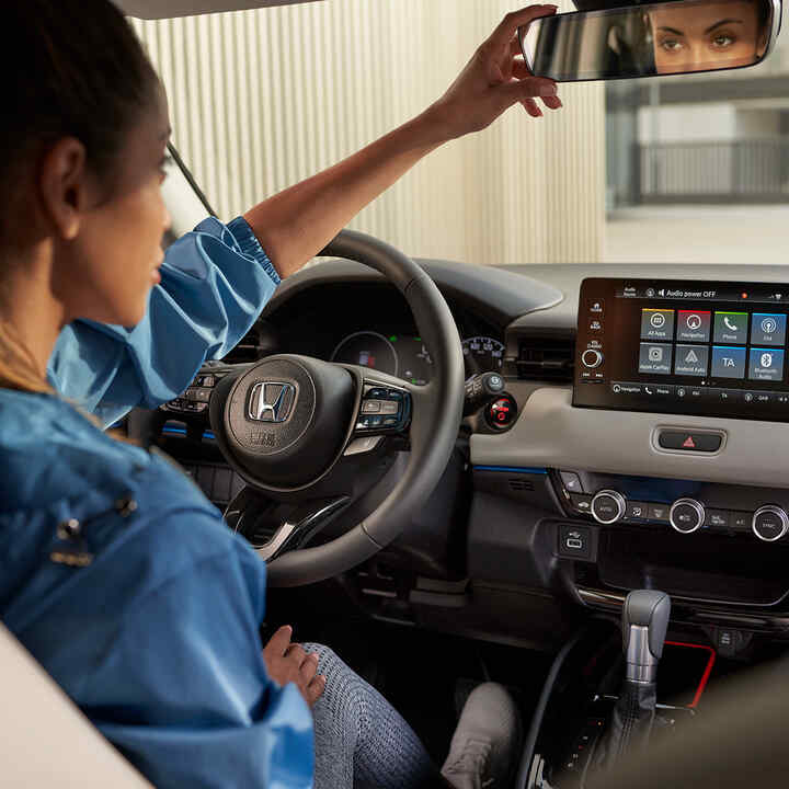 Interior of HR-V's front driver seat and dashboard. 