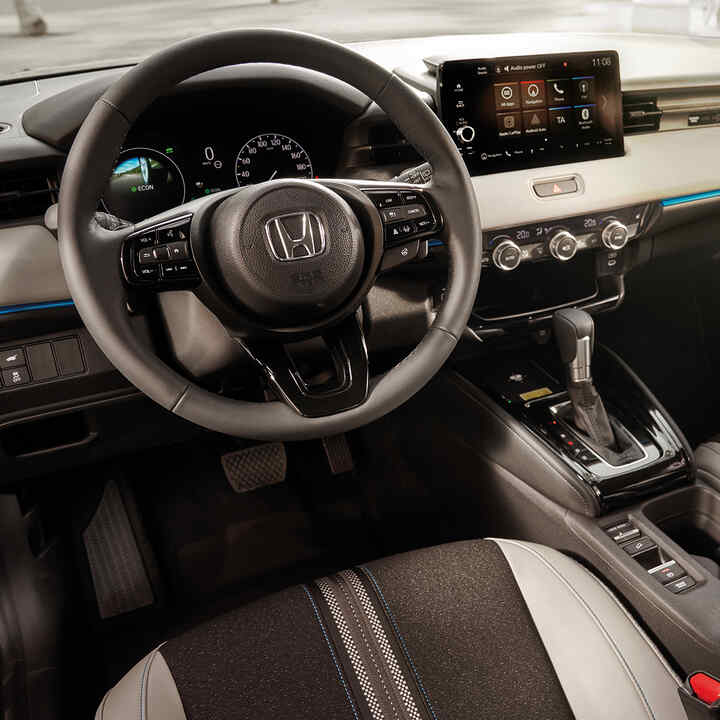 Interior of HR-V's front driver seat and dashboard. 