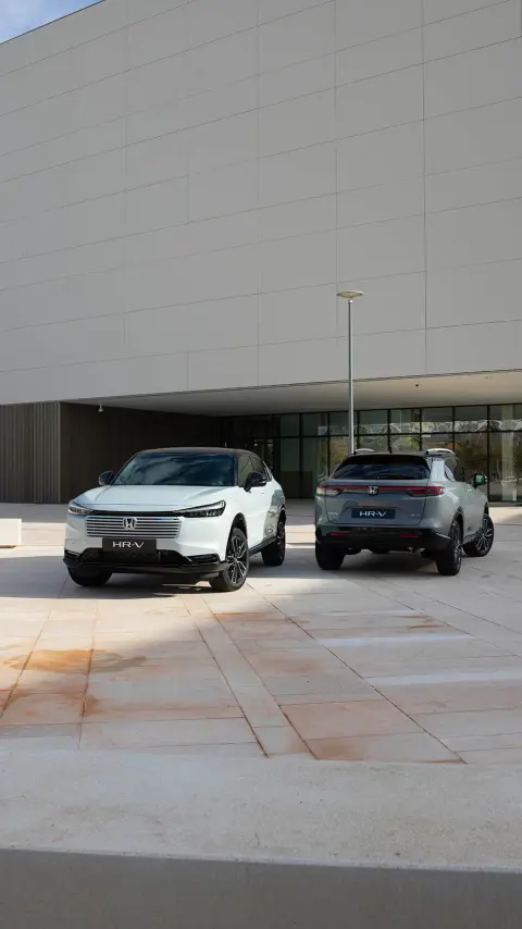 Two Honda HR-V's parket outside of building location. 