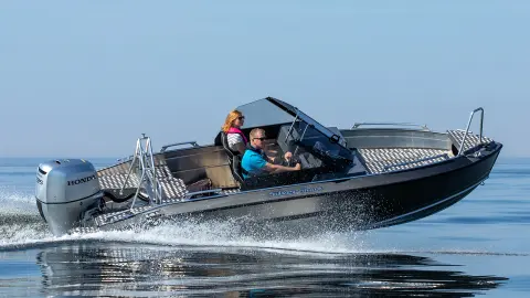 Couple on boat with Honda BF135 engines. 