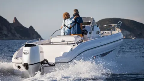 Couple on a Honwave with twin Honda BF150 engines. 