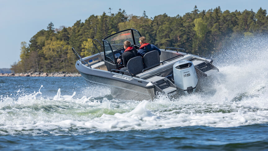 Couple on boat with a Honda BF115 engine. 