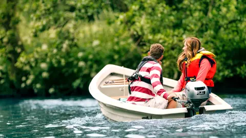 Two people in a boat using the BF2.3 engine.