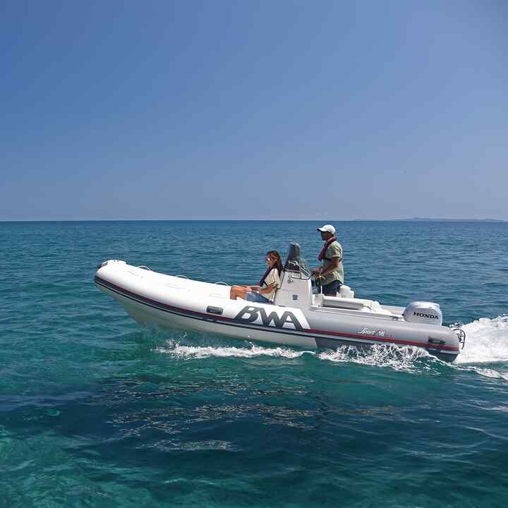 Couple on a side facing Honwave with BF engine in a coastal location. 