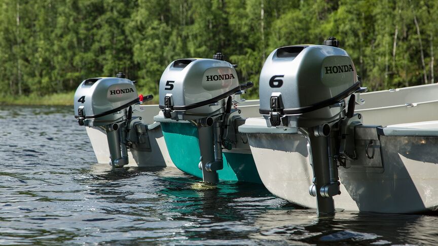 Couple on boat with a Honda BF6 engine. 