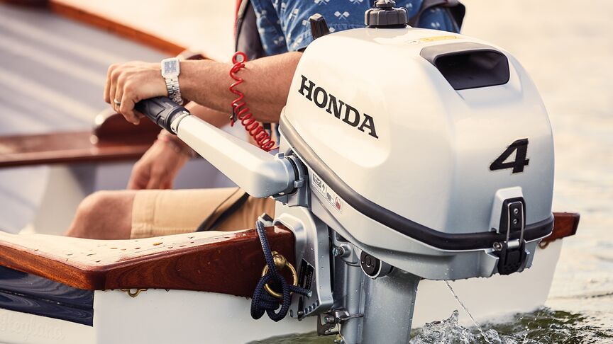 Couple on boat with a Honda BF6 engine. 