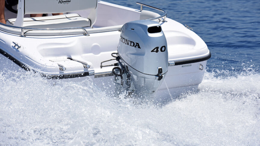 Gentleman on a boat with a B40 engine in coastal location. 