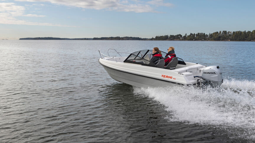 Gentleman on a boat with a B40 engine in coastal location. 