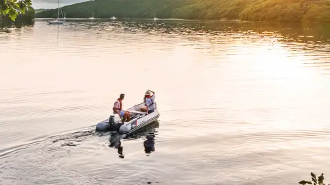 Couple on boat in the lake with a Honda BF8-10 engine.