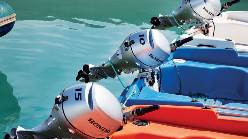 Models in boats in the sea showcasing BF10 engine.