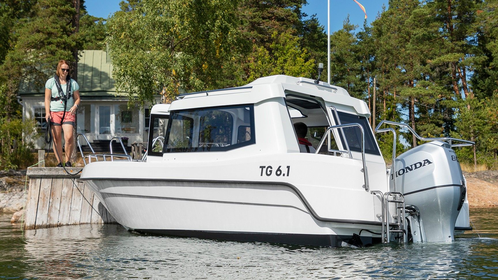 Boat and model in a sea and forest location.