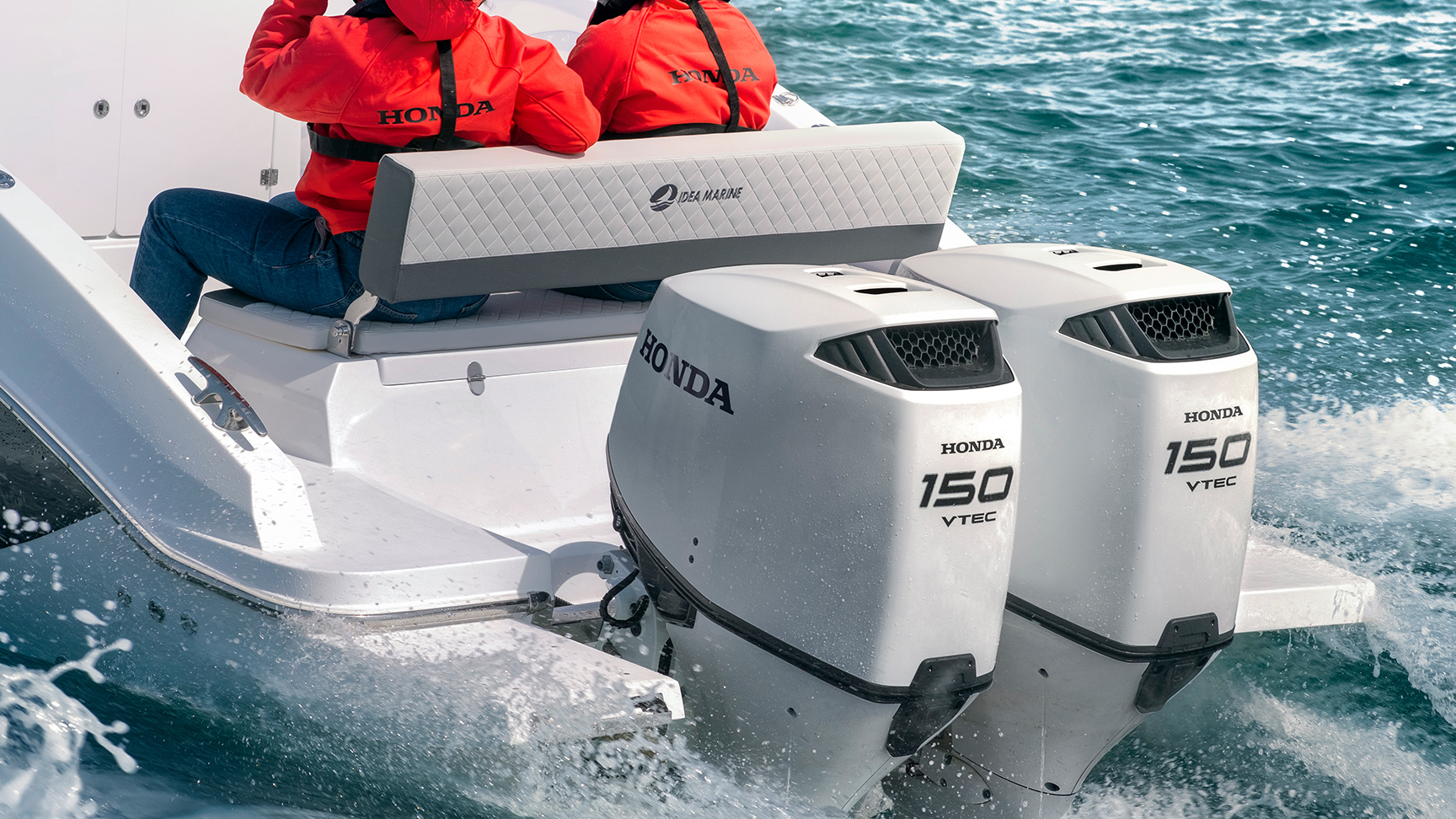 Passengers in red sitting on a speedboat with two engines