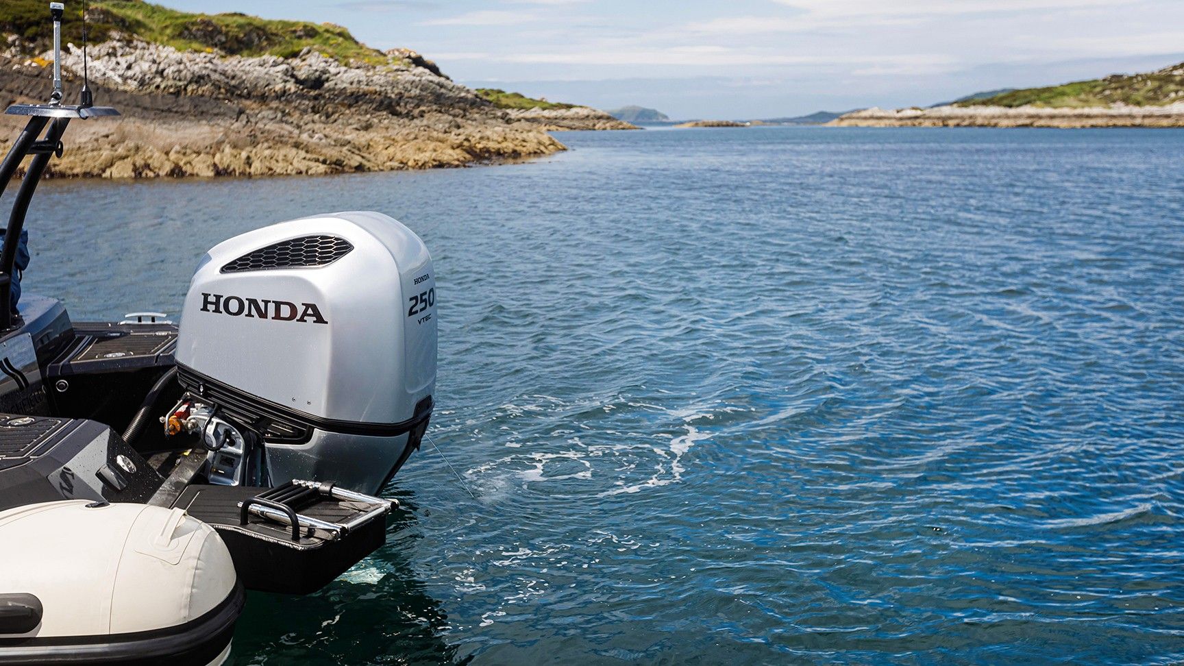 Back of Honda boat in sea location.