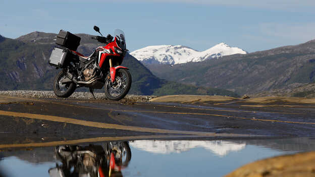 Static Africa Twin with mountains in background