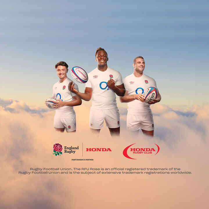 Three England Rugby holding a Honda branded rugby ball